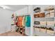 Spacious walk-in closet with metal shelving, providing ample storage for clothes, shoes, and household items at 1129 Bowline St, Winter Haven, FL 33880