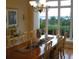 Bright dining room featuring an elegant chandelier, view of the water, and lots of space at 12740 Amber Ave, Clermont, FL 34711