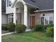 Charming front entrance featuring stone accents and meticulously maintained landscaping at 12740 Amber Ave, Clermont, FL 34711