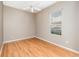 Bedroom with ceiling fan, wood-look floors, and window with blinds at 13852 Eylewood Dr, Winter Garden, FL 34787