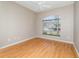 Bright bedroom features a ceiling fan, neutral walls, and wood-look floors at 13852 Eylewood Dr, Winter Garden, FL 34787