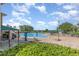 Large community swimming pool area with lounge chairs and umbrellas, perfect for relaxation at 13852 Eylewood Dr, Winter Garden, FL 34787