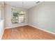 Bright dining room with a chandelier, large window, neutral walls, and wood flooring at 13852 Eylewood Dr, Winter Garden, FL 34787