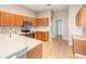 Spacious kitchen boasts tile floors, stainless steel appliances, and ample counter space for food preparation at 13852 Eylewood Dr, Winter Garden, FL 34787