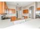Well-equipped kitchen showcases sleek countertops, wood cabinets, and modern appliances for culinary enthusiasts at 13852 Eylewood Dr, Winter Garden, FL 34787