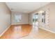 Spacious living room featuring a ceiling fan, wood flooring, and sliding glass doors leading to the pool area at 13852 Eylewood Dr, Winter Garden, FL 34787