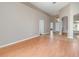 Spacious living room with light wood floors, neutral walls, and tile entryway leading to other rooms at 13852 Eylewood Dr, Winter Garden, FL 34787