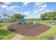A modern playground with swings, slides, and climbing structures for enjoyment at 13852 Eylewood Dr, Winter Garden, FL 34787