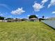 A expansive backyard with a white vinyl fence at 14 Morton Rd, Winter Haven, FL 33881