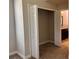 A closet showing built-in shelving and connecting to an adjacent bathroom at 14 Morton Rd, Winter Haven, FL 33881