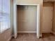 A well-lit, empty closet with shelving and a view of a bright bedroom through the doorway at 14 Morton Rd, Winter Haven, FL 33881