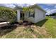 Well-maintained home exterior with manicured landscaping at 14 Morton Rd, Winter Haven, FL 33881