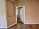Hallway showing the transition between rooms, highlighting the tile flooring and doorway at 14 Morton Rd, Winter Haven, FL 33881