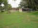 Sprawling backyard with a screened-in patio attached to the house at 1440 Hackl Blvd, Bartow, FL 33830