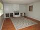 Finished basement with built-in shelving, a fireplace, and a leaf-patterned rug at 1440 Hackl Blvd, Bartow, FL 33830