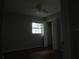 Bedroom featuring hardwood floors, a window, and a closet for storage at 1440 Hackl Blvd, Bartow, FL 33830