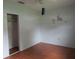 Cozy bedroom with a ceiling fan, closet and hardwood floors at 1440 Hackl Blvd, Bartow, FL 33830