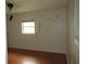 This bedroom has hardwood floors, a window, and fun decals on the wall at 1440 Hackl Blvd, Bartow, FL 33830