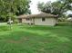 Exterior view showing a single story home with a well kept lawn and an attached garage at 1440 Hackl Blvd, Bartow, FL 33830