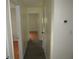 Hallway showcasing doorways leading to other rooms, with new flooring at 1440 Hackl Blvd, Bartow, FL 33830