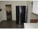Bright kitchen featuring modern stainless steel refrigerator and wood-look flooring at 1440 Hackl Blvd, Bartow, FL 33830