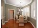 Cozy breakfast nook with hardwood flooring and a bright window with plantation shutters at 1589 Royal Forest Ct, Lakeland, FL 33811