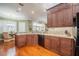 Well-equipped kitchen with granite countertops, custom cabinets, and lots of natural light at 1589 Royal Forest Ct, Lakeland, FL 33811