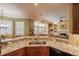 Beautiful kitchen with granite countertops, a stainless steel sink, and stylish backsplash and appliances at 1589 Royal Forest Ct, Lakeland, FL 33811