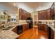 Open kitchen with granite countertops, stainless steel appliances, and a view of the living space at 1589 Royal Forest Ct, Lakeland, FL 33811