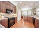 Spacious kitchen with custom cabinetry, granite countertops, and stainless steel appliances at 1589 Royal Forest Ct, Lakeland, FL 33811