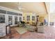 Spacious covered lanai offering a comfortable seating area and an outdoor kitchen at 1589 Royal Forest Ct, Lakeland, FL 33811