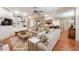 Inviting living room showcasing built-in shelving, hardwood floors, and comfortable, stylish furniture at 1589 Royal Forest Ct, Lakeland, FL 33811