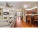 Bright and airy living room showcasing hardwood floors, built-in shelving, and an open layout at 1589 Royal Forest Ct, Lakeland, FL 33811