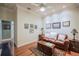 Comfortable living room featuring a leather sofa, wooden furniture, and tasteful decor at 1589 Royal Forest Ct, Lakeland, FL 33811