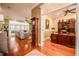 Open-concept living space boasting hardwood floors, neutral decor, and seamless flow to the office at 1589 Royal Forest Ct, Lakeland, FL 33811