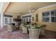 Inviting covered patio area with an outdoor table and comfortable seating at 1589 Royal Forest Ct, Lakeland, FL 33811
