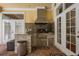 A full outdoor kitchen with a built-in grill and countertop, great for entertaining at 1589 Royal Forest Ct, Lakeland, FL 33811