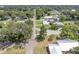 Scenic aerial view of a quiet residential street lined with mature trees and well-maintained homes at 1685 Kissengen Ave, Bartow, FL 33830