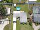 Aerial shot shows the home's layout, pool, storage, and backyard space, all within fenced boundaries at 1685 Kissengen Ave, Bartow, FL 33830