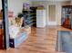 Basement showcasing wood-look flooring with refrigerator and storage at 1685 Kissengen Ave, Bartow, FL 33830