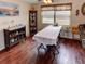 Cozy dining room featuring wood floors, a large table, and a display cabinet for elegant meals at 1685 Kissengen Ave, Bartow, FL 33830