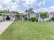 Charming single-story home with manicured lawn and carport, perfect for outdoor living at 1685 Kissengen Ave, Bartow, FL 33830