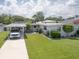 Charming home featuring a well-manicured lawn and covered parking for a welcoming curb appeal at 1685 Kissengen Ave, Bartow, FL 33830