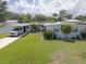 Charming home with well-maintained lawn, covered parking, and inviting curb appeal at 1685 Kissengen Ave, Bartow, FL 33830