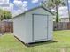 Backyard shed with door, providing secure storage in a well-maintained outdoor space at 1685 Kissengen Ave, Bartow, FL 33830