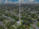 An aerial view showcases the home, its surrounding landscape and proximity to the city at 1715 Lando Ln, Orlando, FL 32806