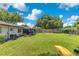 Enjoy this sprawling backyard with mature landscaping, a screened porch, play area, and lots of space for entertaining at 1715 Lando Ln, Orlando, FL 32806