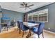 Stylish dining room with hardwood floors, a modern ceiling fan, and a beautiful wood table at 1715 Lando Ln, Orlando, FL 32806