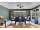 Bright dining room with hardwood floors, modern ceiling fan, and ample natural light at 1715 Lando Ln, Orlando, FL 32806