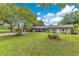 Charming single-story home with a well-maintained lawn and inviting carport entrance at 1715 Lando Ln, Orlando, FL 32806